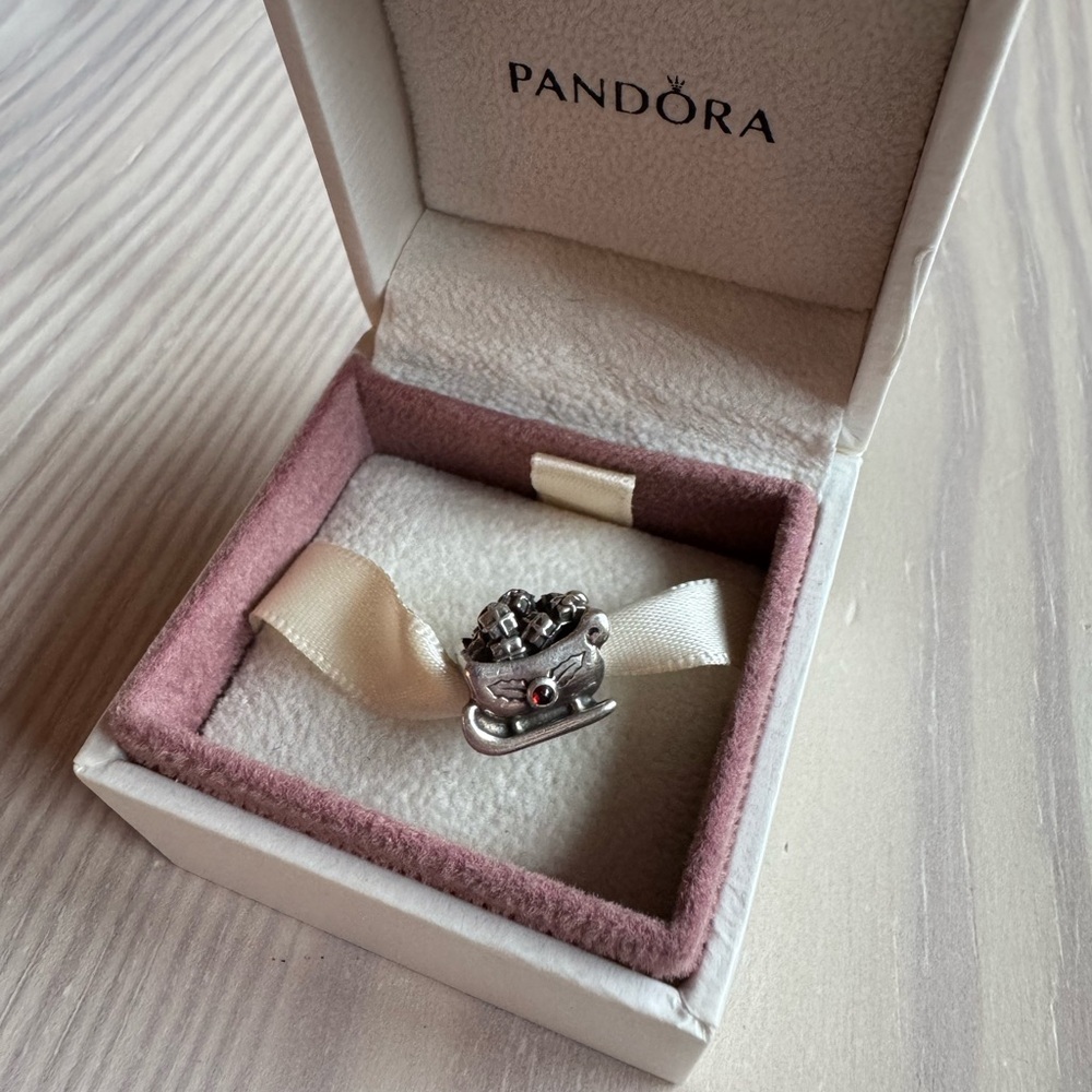 Pandora Silver Bracelet Charm.
 Red Stone Accent.
“Retired” Santa Claus Sleigh